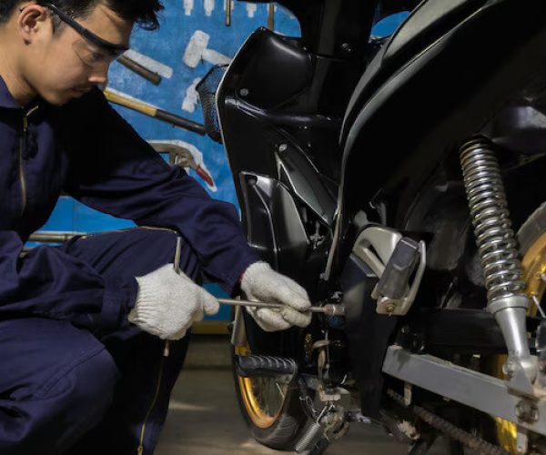 people-are-repairing-motorcycle-use-wrench-work_39733-344